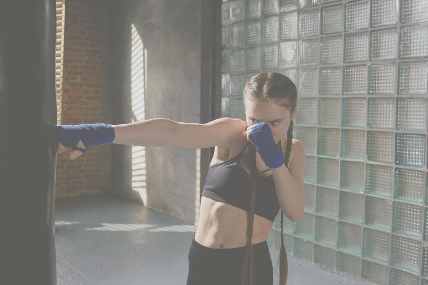 Varied CrossFit movements demonstrated in a home gym setup